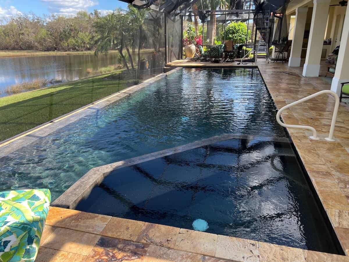 Plunge pool with dark finish and lake view — Venice, FL