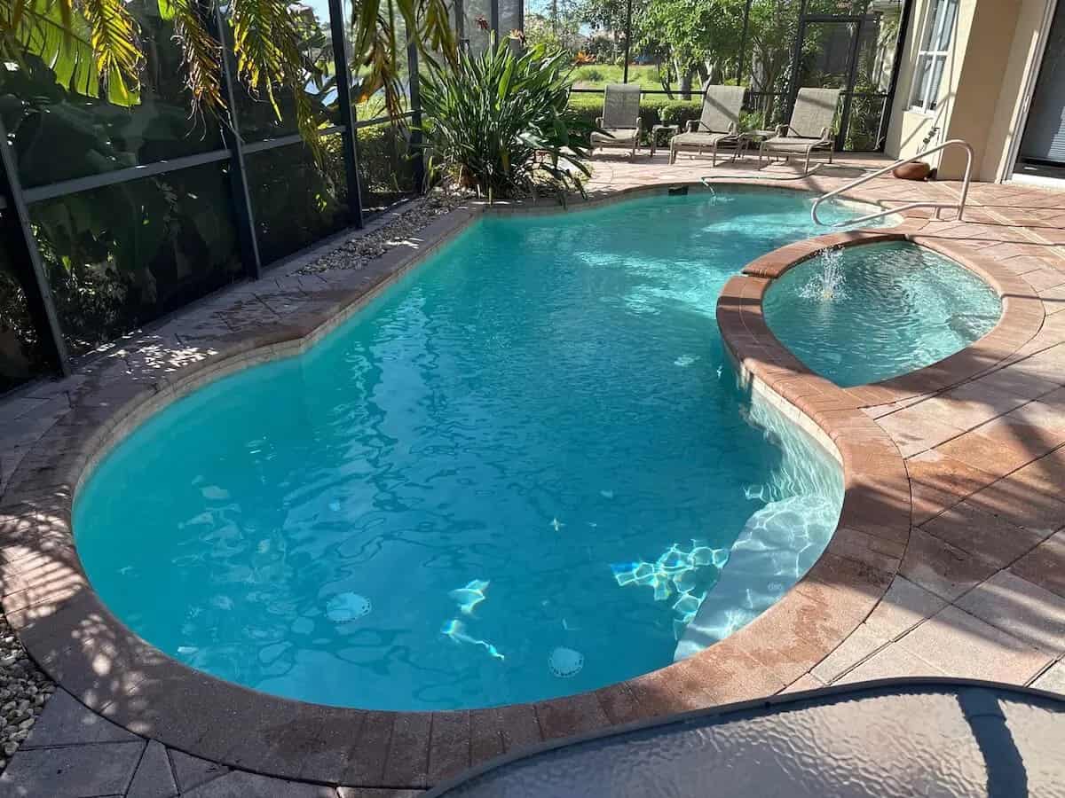 Custom spa addition with tropical landscaping